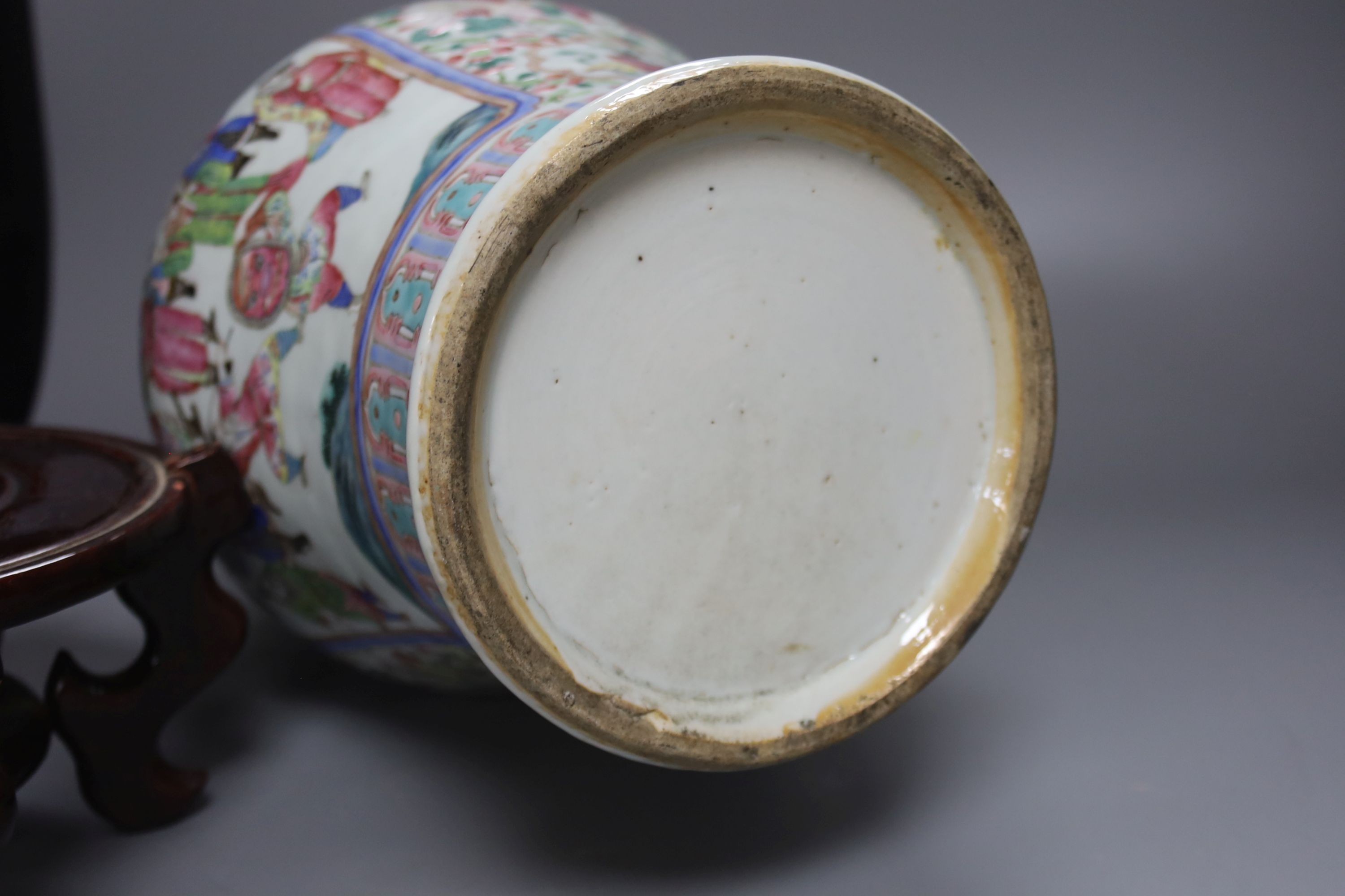 A large Chinese famille rose two handled vase, late 19th century, wood stand, restored 54cm incl stand